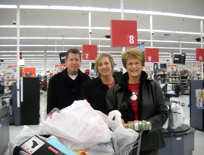 The Rotary Club of Jackson Township recently shopped for their
"Adopt-A-Family" organized by A Community Christmas of Canton.
Pictured are Kevin Heraghty, Service Chair, Tiffany Gill, Club President and Jan Hein, Past President.