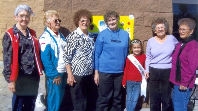Shown during the VFW Auxiliary 3693 annual Buddy Poppy Drive on Nov. 6 are, from left, Aledine Guedry, Mabel Felps, Lillie Frederic, Gertie Savoy, Little Miss VFW Buddy Poppy Queen Brook Crehan, Norma Luske and Alice Parent.