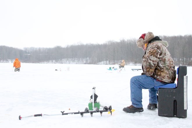 Terry Johnson, who lives just north of Ionia, is at the Ionia State Recreation Area’s Sessions Lake ice fishing Tuesday evening. He has been ice fishing regularly for three years.