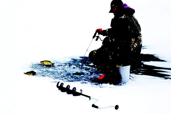 This gentleman enjoys ice fishing on Canandaigua Lake on Sunday, Dec. 19.