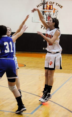 OA's Caitlyn Abela takes a shot from the edge of the circle. Asia Mitchell (13 points), Abela (12 points) and Nicole Bostic (nine points) led the host Tigers (3-1) to a 53-42 victory over Plynmouth South in the opening round of the Sue Rivard Holiday Classic.