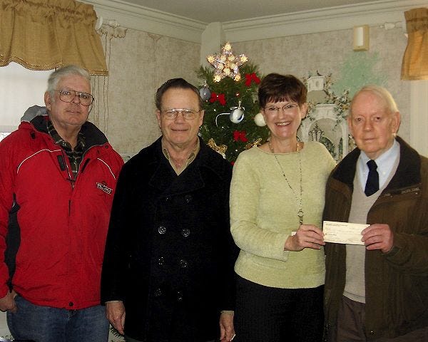 Courtesy photo
The Rochester Chapter 1055 of the National Active and Retired Federal Employees are donating $50 to the Homemakers to help with their community service program. Shown here are Raymond LeFebvre, Paul Hopkins and Charles Foster of NARFE presenting the check to Rene Philpott of the Homemakers.