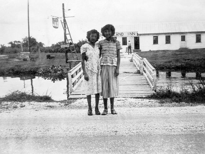 Ophelia Brunet (right) stands in front of the Dreamland Inn in Pointe-aux-Chenes with a friend around 1950.