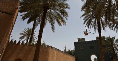 An Iraqi helicopter hovering over the Ishtar Gate in May. Groundwater and excavations have eaten away brick reliefs at its base.
