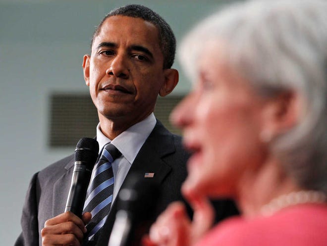 FILE - In this June 8, 2010 file photo, President Barack Obama, listens as Health and Human Services Secretary Kathleen Sebelius speaks during a town hall meeting in Wheaton, Md. Eager to show who's now in charge, the House's new Republican majority plans to vote to repeal President Barack Obama's landmark health care overhaul before he even shows up in their chamber to give his State of the Union address. (AP Photo/Alex Brandon, File)