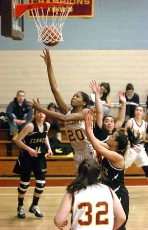 Spellman's Alexis Udoji, center, scores a basket and is fouled on the play in a game against Bishop Fenwick on Tuesday, Jan. 4, 2011, in Brockton.


 
Marc Vasconcellos /The Enterprise: PHOTO TAKEN ON January 04, 2011: Brockton
WITH STORY BY TOM HINKLEY