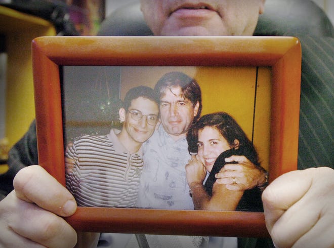 A Gosule family photo from the mid-1990s shows Les Gosule, center, with his nephew Louis Goldberg, left and his daughter Melissa, who was murdered on July 11, 1999.