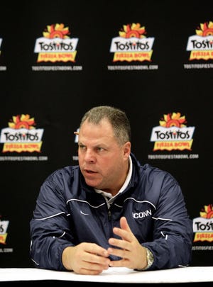 Connecticut defensive coordinator Hank Hughes speaks with the media Monday, Dec. 27, 2010 at the team hotel in Scottsdale, Ariz. Connecticut will face Oklahoma in the Fiesta Bowl on Jan 1, 2011.