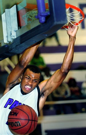 Paine's Tony Baker dunks during the Lions' three-point win Wednesday over Claflin.