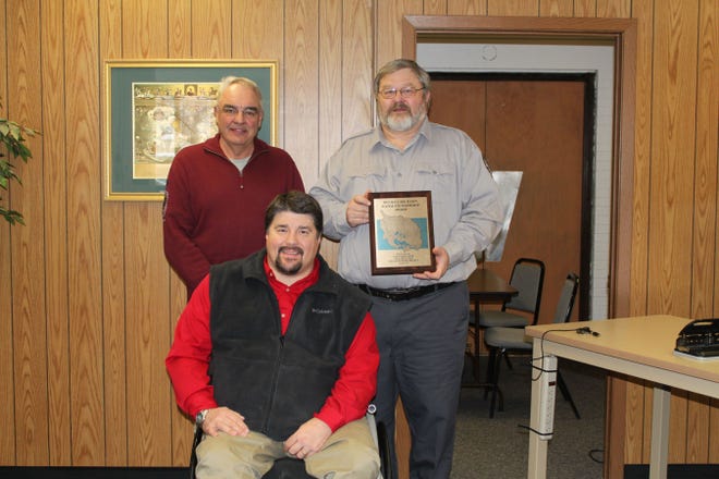 Lynn R. Schlueter, the statewide ANS coordinator for the North Dakota Game and Fish Department was awarded the Water Stewardship Award at this week’s Ag Extension Roundup. He is pictured here with Mike Tweed, Eddy County, who chairs the Devils Lake Basin Joint Water Resource Board and Jeff Frith, manager of the DLBJWRB.