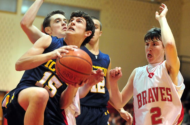 Victor's John Maloney (15) recovers a rebound before Canandaigua's Tyler Serafine (2) at Canandaigua on Wednesday January 5, 2010.