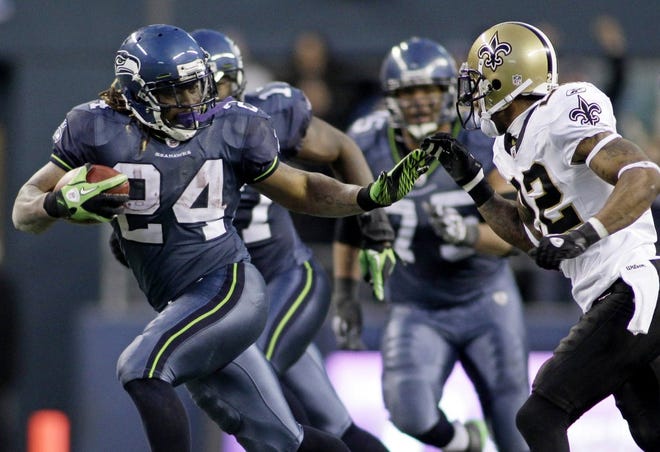 Seattle's Marshawn Lynch (24) breaks away on the clinching touchdown run in the fourth quarter of Saturday's NFC wild-card game against New Orleans.
