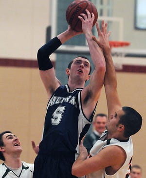 Medway's Matt Ford goes up to the basket against Hopkinton on Friday.