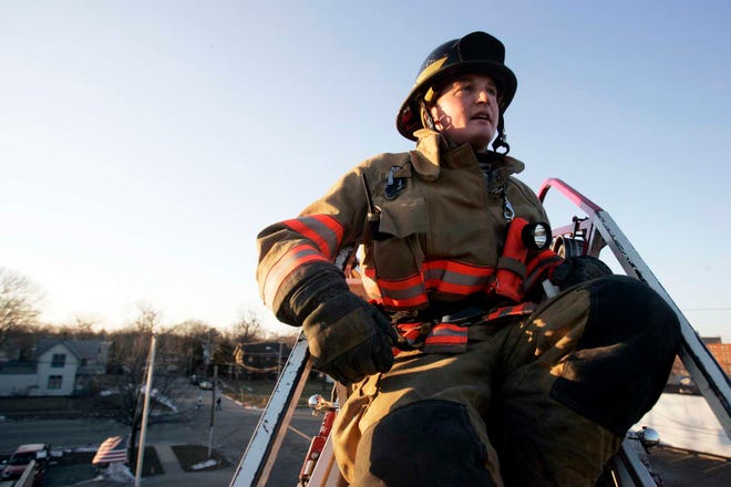 Firefighter Marcus Owens trains on an extended ladder truck Thursday, Jan. 6, 2011, at Fire Station 2 in Rockford.