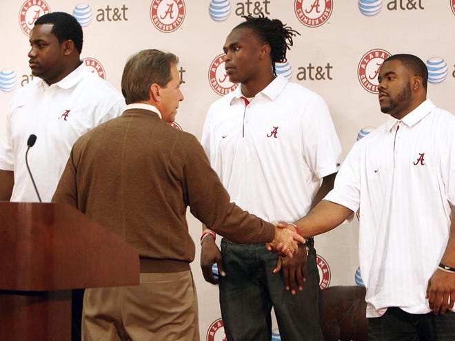 Nick Saban shakes hands with Mark Ingram after Ingram, Marcell Dareus, left, and Julio Jones announced they will enter the NFL draft. Each is expected to be chosen in the first round of the draft April 28-30 in New York City.