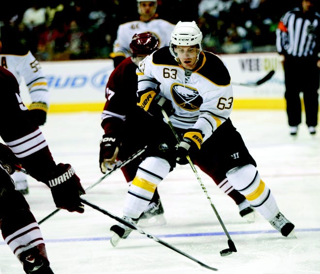Buffalo Sabres left wing Tyler Ennis carries the puck across the blue line against the Phoenix Coyotes during the first period of an NHL hockey game on Saturday, Jan. 8, 2011, in Glendale, Ariz. (AP Photo/Rick Scuteri)