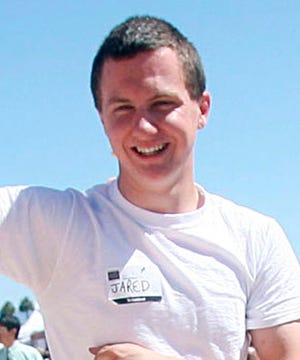 This March 2010 photo shows a man identified as Jared L. Loughner at the 2010 Tucson Festival of Books in Tucson, Ariz. The Arizona Daily Star, a festival sponsor, confirmed from their records that the subject's address matches one under investigation by police after a shooting in Tucson that left U.S. Rep. Gabrielle Giffords wounded and six others dead.