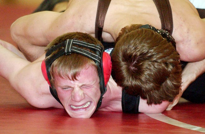 Red Jacket's Kyle Sadler tries to fight off East Rochester's Nick Rider in the 135lbs Class at Red Jacket on Tuesday January 11, 2011.