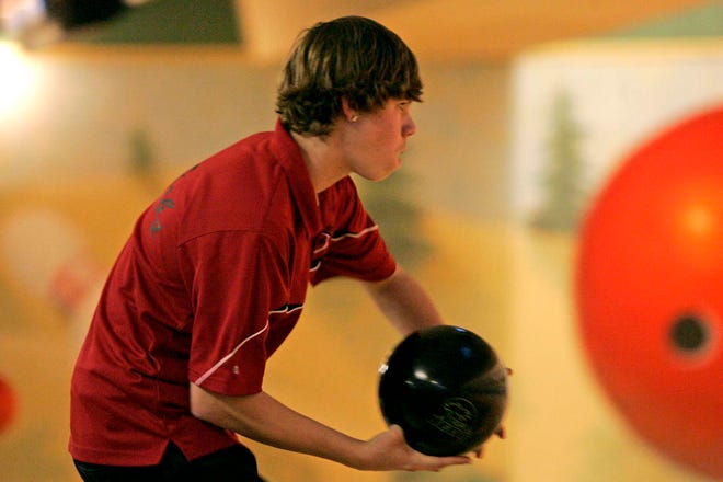 East High School's Matt McCurry bowls at Forest Hills Bowling Center on Monday, Jan. 10, 2011.