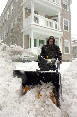 Stephen Bakish, Brockton, uses a snow blower to clean his driveway on Warren Avenue during a Nor' Easter on January 12th in Brockton.