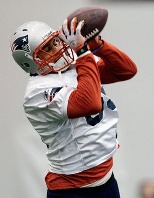 Patriots tight end Aaron Hernandez catches a ball during practice.