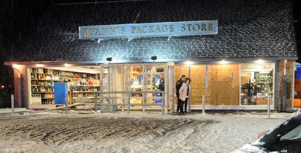 A female driver was arrested for driving under the influence after crashing her car into the Hyannis Package Store at the West End Rotary on Wednesday night. The window, at left, was where the car crashed into the building, causing damage similar to that on the right side of the entrance, which was caused by a car crash on Nov. 2.