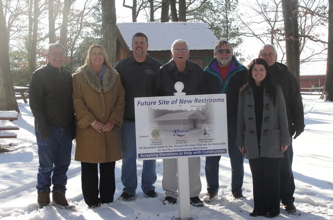 A sign is up marking the location where new bathrooms will be constructed at Red Run Park. Representatives from Washington Township, the Rouzerville Lions Club, the Rouzerville Business Association and local businesses visited the site Thursday. From left: Bob Backer, Dianne Stadler, Chad Ely, Stewart McCleaf, Allen Scott, Jamie Baker and Mike Christopher.