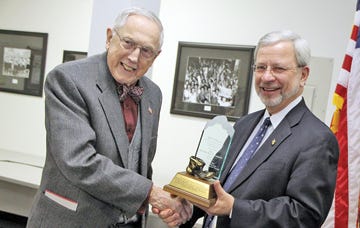 Noted author, lecturer and historian Bill Wilcox Jr., left, who first came to 'The Secret City' as a Y-12 chemist in 1943, is presented with a 2011 Muddy Boot Award by Gerald Boyd, manager of the U.S. Department of Energy's Oak Ridge Operations, during a Jan. 14 meeting of the East Tennessee Economic Council.