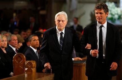 In this Aug. 29, 2009 file photo, Sargent Shriver is escorted to his seat in the church by his son Anthony Kennedy Shriver before funeral services for U.S. Sen. Edward Kennedy at the Basilica of Our Lady of Perpetual Help Basilica in Boston. A medical center spokeswoman on Sunday, Jan. 16, 2011 said Shriver has been hospitalized outside Washington.