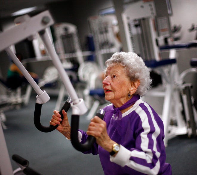 Phyllis Dickey, 95, of Kingston uses one of the weight machines at the Kingsbury Club.