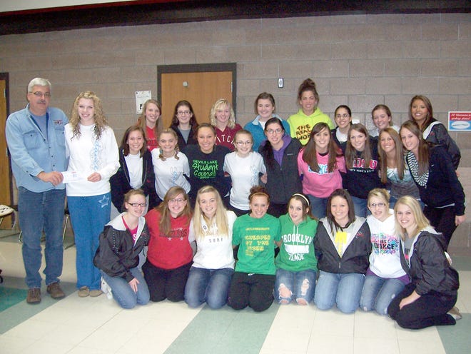 The Dazzlers Dance Team is pictured with Randy Schemionek of the Devils Lake Youth Activities Association.
