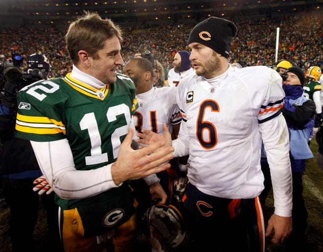 Green Bay Packers quarterback Aaron Rodgers (12) talks to Chicago Bears quarterback Jay Cutler after a Jan. 2 game in Green Bay, Wis. The Associated Press