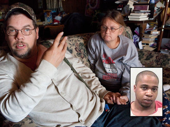 Patrick Osborne talks about the day he was shot by two masked gunmen at the Domino's Pizza store that he managed in Mansfield, OH, on December 13, 2008. He sits on the couch at his home in Cardington, OH, November 7, 2010 as his wife, Sandy Estep, holds his hand. Victor Walker, inset, was involved in a number of armed robberies in the Mansfield, Ohio, area where he use to live.