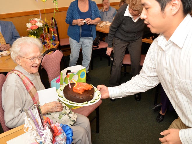 Restaurant Manager Ming Zhuo delivers a birthday cake to Lelah Field as she celebrates her 100th birthday surrounded by friends and family Saturday at the China Lee Buffet in Ocala. Field has seen 18 presidents come and go, from William Taft to Barack Obama. As an employee in the phonographic records department at Sears Roebuck at Chicago, she also witnessed many releases by the rock icons of the 1960s and '70s. "I remember Jimi Hendrix and when he died, and Janis Joplin," Field said.