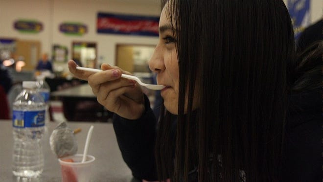 Sixth-grader Luisa Loera tries some reduced-fat macaroni and cheese at the Georgetown school district's taste test. The district asked students to vote for foods they want on future lunch menus.
