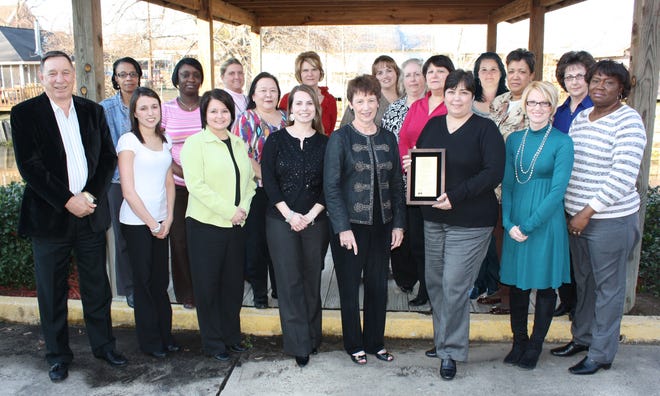 The Ascension Parish Finance Department is shown with it’s recent certificate of Achievement for Excellence in Financial Reporting award. front row, from left, Parish President Tommy Martinez, Theresa Poche’, Dawn Caballero, Lynda Timmons, CFO Gwen LeBlanc, Amanda Berot, Jamie Villnerve and Joan Shivers. Second row, from left, are Cynthia LeBlanc, Angela Colar, Charlotte White, Ann Falcon, Shelley Villar, Ashley Barnes, Laurie Lemoine, Sherri Bellina, Toni Ourso, Carol Celestine and Janice Brown.