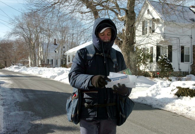 Letter carrier John McGrath had to really bundle up to walk his route along Commonwealth Avenue in West Bridgewater on Monday, Jan. 24, 2011.