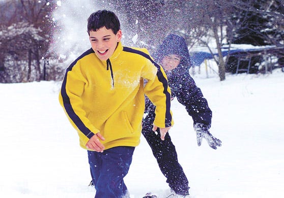 Guy Morse, 11, can't escape from the snowball thrown by Brett Havens, 12 as the boys participated in snowball fight on Tuesday in Middlesex.