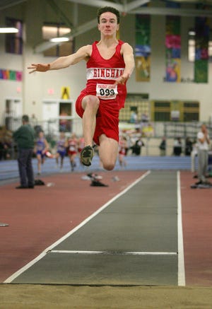 Hingham's Chris McDowell competes in the long jump at the Reggie Lewis Center in Boston, Tuesday, January 25, 2011.