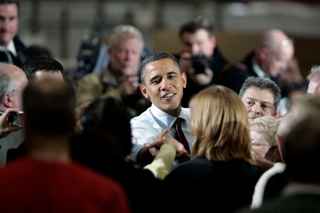 President Barack Obama greets people after a speech Wednesday, Jan. 26, 2011, inside of Orion Energy Systems in Manitowoc, Wis.