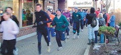 Runners take advantage of downtown Holland’s snowmelt system during the Snowmelt Shuffle in January 2009. The annual downtown 5K run/1-mile walk is Saturday, Feb. 5.