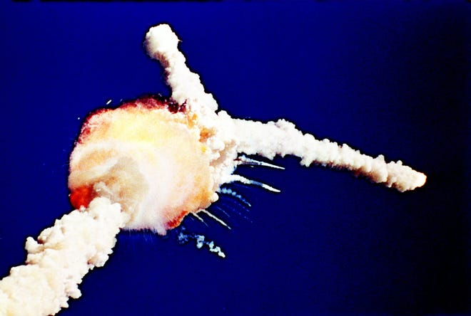 In this Jan. 28, 1986, file photo, the space shuttle Challenger explodes shortly after lifting off from the Kennedy Space Center in Cape Canaveral, Fla.