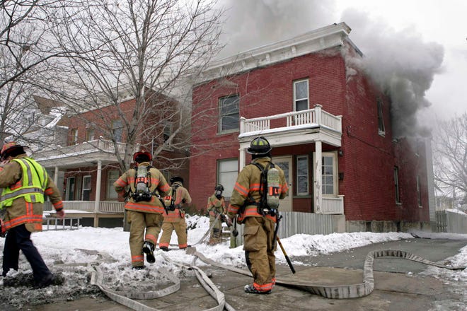The Rockford Fire Department works to put out a fire Saturday, Jan. 29, 2011, in the 1400 block of Charles Street in Rockford.