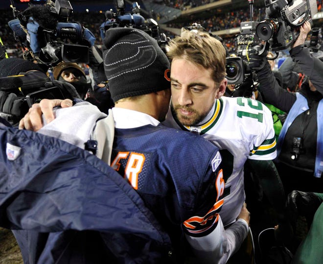 Green Bay Packers quarterback Aaron Rodgers (12) and Chicago Bears quarterback Jay Cutler greet each on the field after the Packers' 21-14 win over the Bears in the NFC Championship NFL football game Sunday, Jan. 23, 2011, in Chicago. (AP Photo/Jim Prisching)