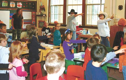 Responsibility was the October Kids for Jesus Virtue of the Month at St. Mary’s School in Sault Ste. Marie. Above, Principal Maria Farney (a.k.a. Señor Gus, in white cowboy hat) and Mrs. Laurie Swanson (a.k.a. Señor Luis, in black cowboy hat) made rounds to all classrooms doing the "Responsibility Round-up" dance with students.