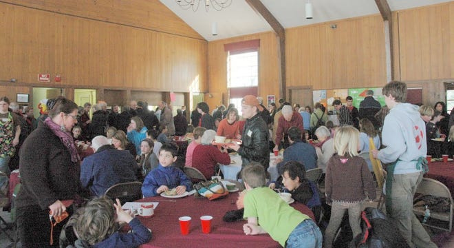 A large crowd packed Old Ship Parish House at stuffed potato fundraiser for youth outreach trip to New Orleans.