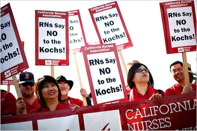 Protesters in California on Sunday outside a political retreat run by the billionaire Koch brothers.
