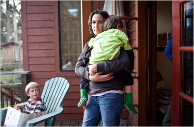 Katharina Sandizell, at home with her sons Jacob, left, and Luca, helped block meter trucks in Marin County.