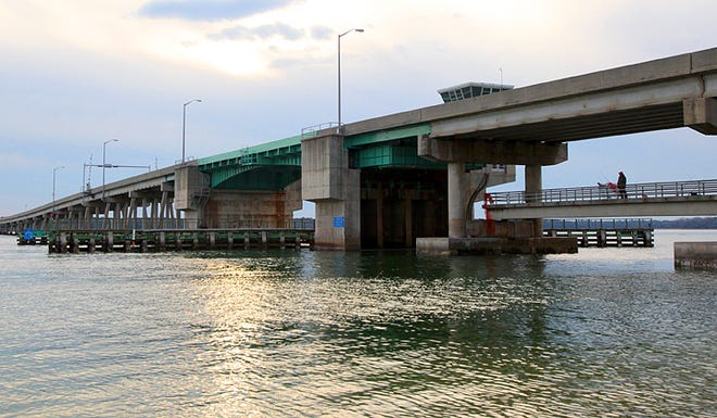 A lone fisherman looks for a catch under the County Road 206 Bridge on Sunday. By DARON DEAN, daron.dean@staugustine.com