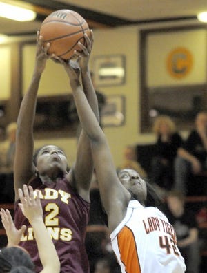 New Brighton's Kaitlyn Hopkins, left, and Beaver Falls' Kayon Ward try to pull down a rebound.